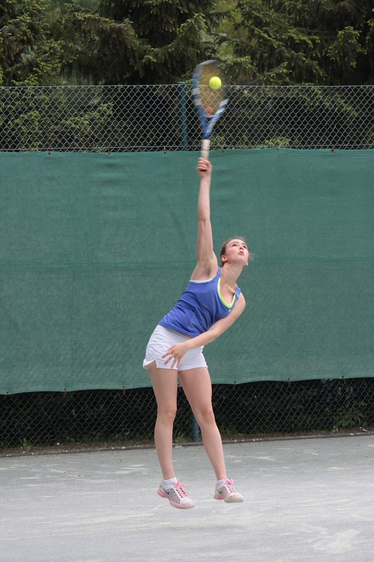 Talia Gibson and the Next Chapter of Australian Tennis A tennis player serving during a match