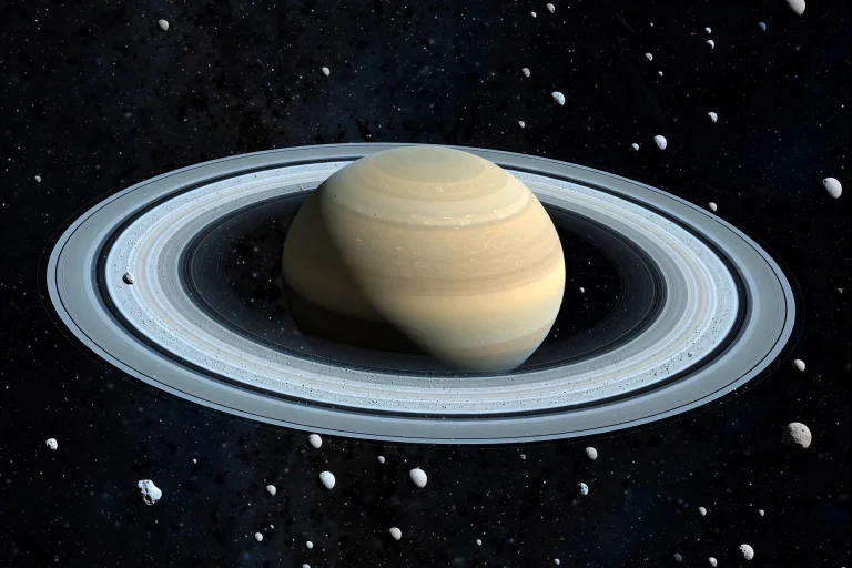 Saturn Just Gained 128 Moons. Here Is How Astronomers Found Them Saturn and its rings with numerous small moons scattered around it